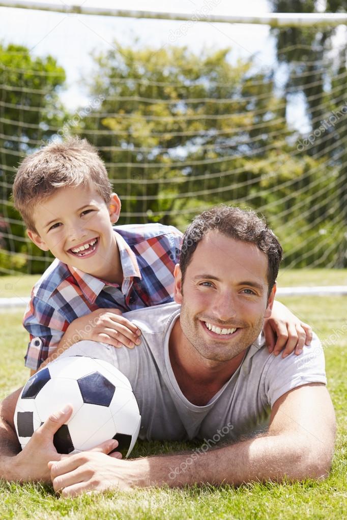 depositphotos_102801816-stock-photo-father-and-son-with-football